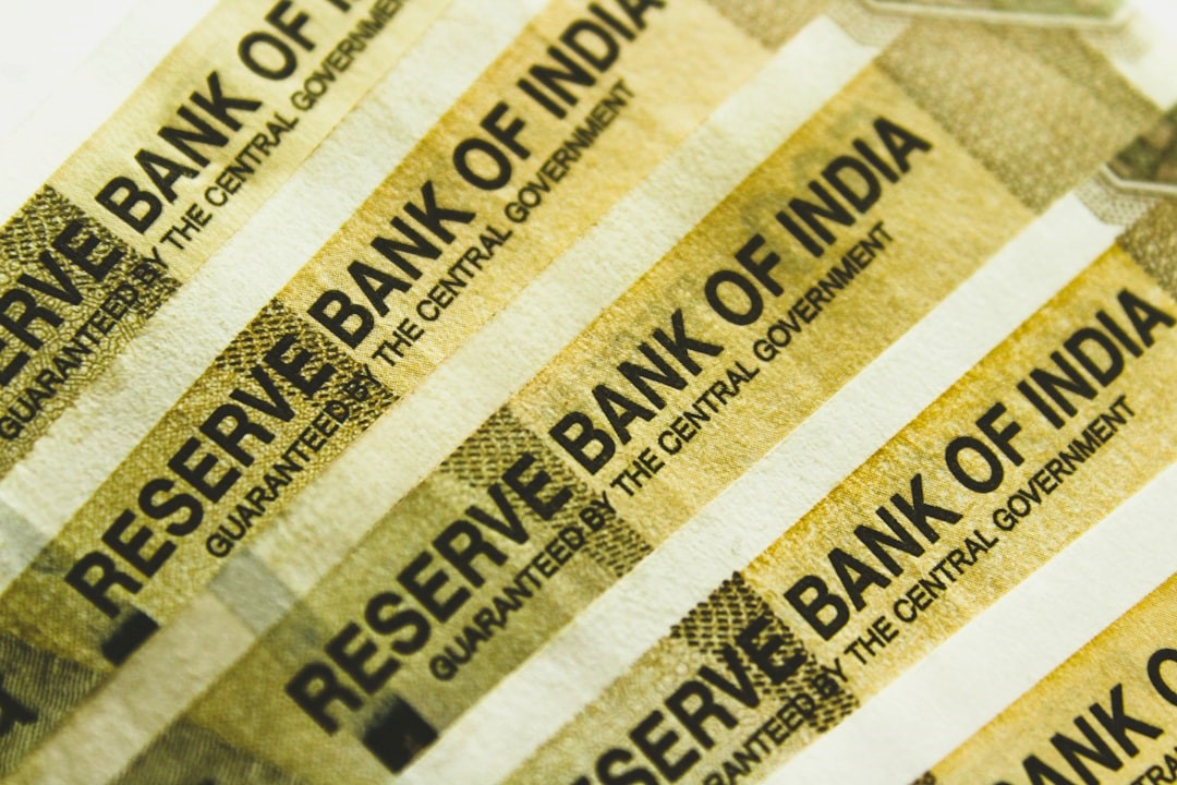 Close-up of Indian rupee notes showing the full name of RBI